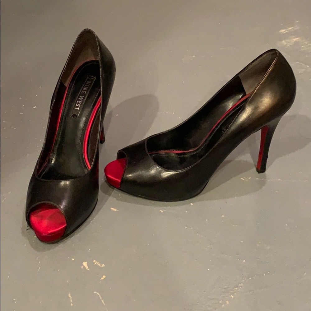 Black pumps with red peep toe and red bottoms